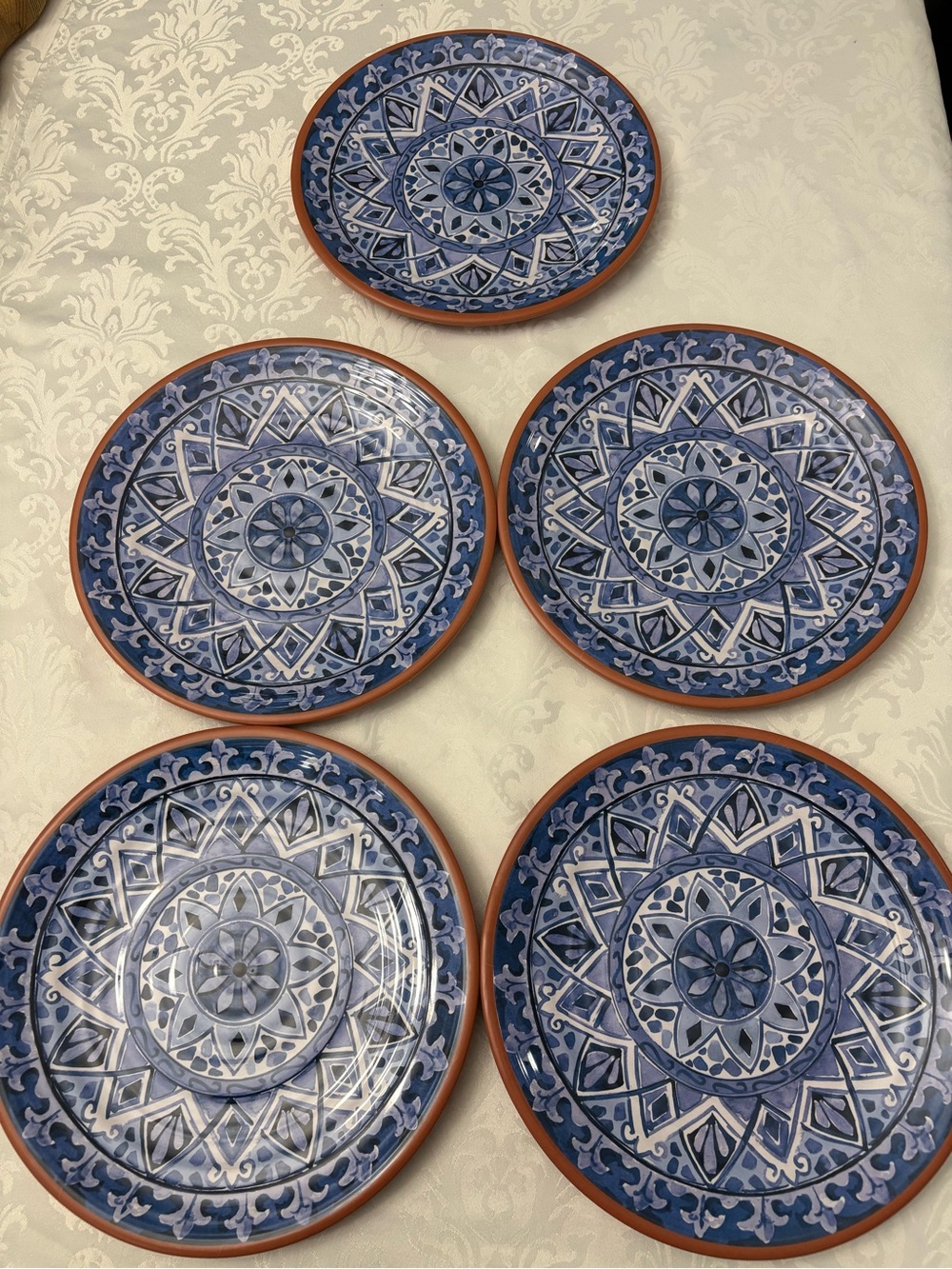 Tommy Bahama melamine set of 5 plates. Spanish tile terracotta medallion design